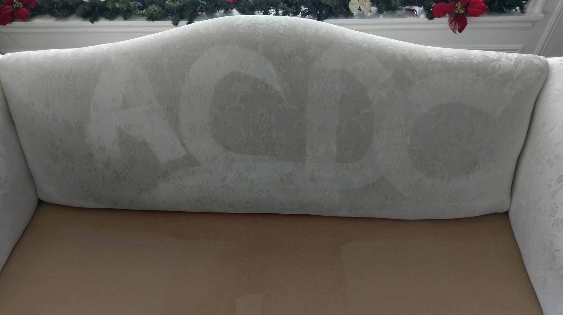 ACDC letters extracted into an upholstered sofa back