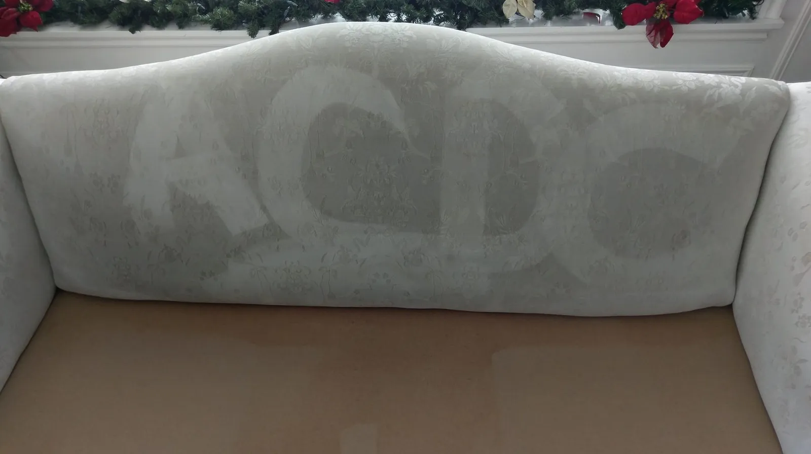 ACDC letters extracted into an upholstered sofa back