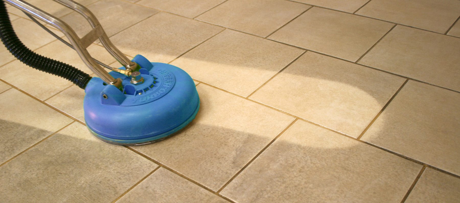 Tile and grout being steam cleaned